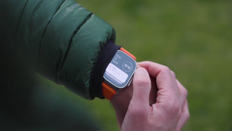 Scrolling-Through-Icons-On-Apple-Smart-Watch-Ultra-2-On-Wrist-Outside