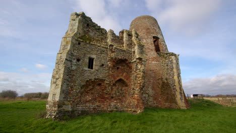 Wide-shot-of-St-Benet’s-abbey-16th-century-gatehouse-with-18th-century-windmill