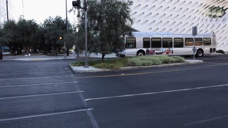 A-metro-bus-travels-down-the-street-in-the-financial-district-in-front-of-museums