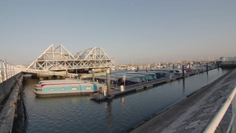 Wide-shot-of-a-marina-with-boat-houses