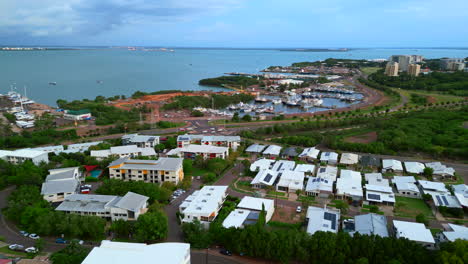 Aerial-Drone-of-Stuart-Park-in-Darwin-NT-Suburb-With-Port-Marina-and-City-Skyline-Overlooking-Coast