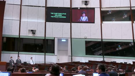 Carrie-Lam,-former-Hong-Kong's-chief-executive,-is-seen-on-the-main-chamber's-screen-as-she-delivers-the-annual-policy-address-at-the-Legislative-Council-building