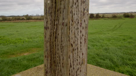 corner-on-shot-of-the-coins-in-the-wood-that-makes-up-the-cross-of-peace-with-in-the-ruins-of-St-Benet’s