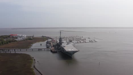 Aerial-descending-close-up-shot-of-the-historic-USS-Yorktown-CV-10-aircraft-carrier-at-Patriot's-Point-in-Mount-Pleasant,-South-Carolina