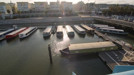 Panoramic-shot-of-a-marina-with-boat-houses