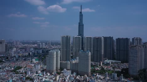 Ho-Chi-Minh-city-and-Binh-Thanh-skyline-on-sunny-day-featuring-landmark-building-from-flying-in-drone-shot