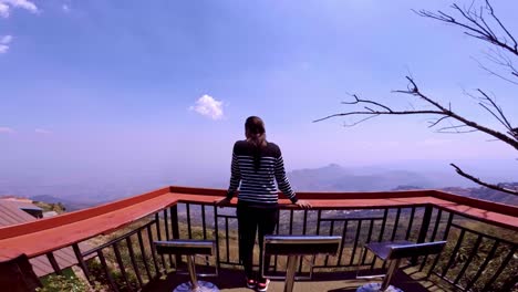 Beautiful-young-girl-enjoying-the-view-at-hill-stop-view-point