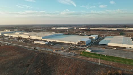 Aerial-orbit-of-Ford's-Megacampus,-BlueOval-City-at-Sunset-in-Stanton,-TN