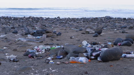 Environmental-pollution:-Garbage-litters-sandy-beach-on-ocean-coast