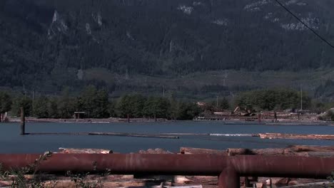 Squamish-river-in-sunny-day-with-logging-trucks