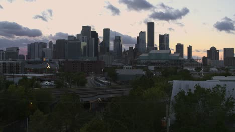 Drone-shot-that-reveals-downtown-Houston,-Texas-during-sunset