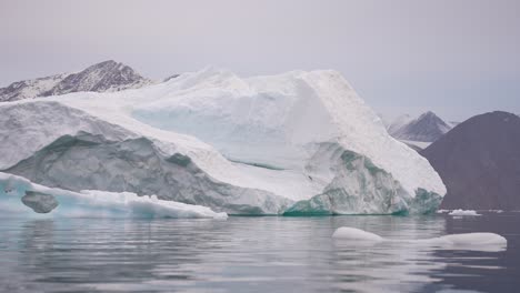 Massive-Iceberg-in-Cold-Water-of-Fjord,-Svalbard-Island-Archipelago,-Norway