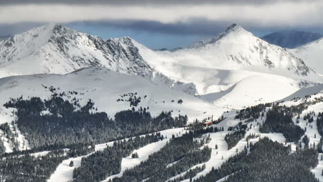 Vail-pass-i70-perspective-of-Copper-Mountain-ski-resort-American-Fyler-lift-trail-runs-ten-mile-range-Leadville-Colorado-ikon-Rocky-snowy-winter-spring-snowy-peaks-evening-clouds-sunset-upward-motion