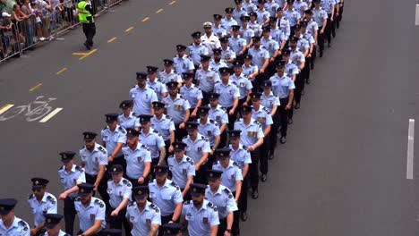 Air-men-and-women-from-Royal-Australian-Air-Force-uniformly-marching-down-the-street-in-Brisbane-city,-amidst-the-solemnity-of-the-Anzac-Day-commemoration