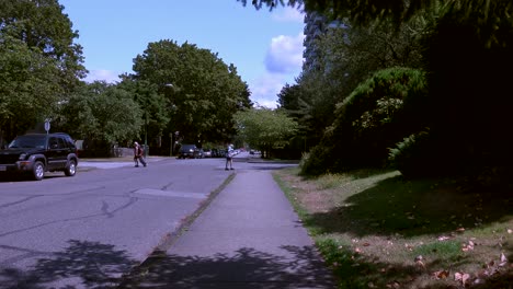 Dolly-shot-moving-on-sidewalk,-man-with-cane