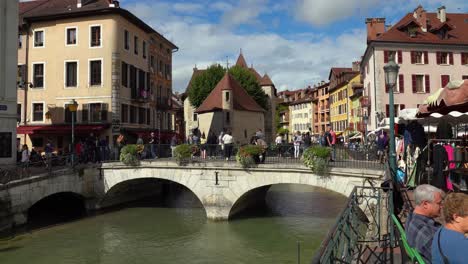 The-imposing-castle-Le-Palais-de-I'Île-is-situated-between-two-bridges-on-the-Thiou-River,-and-visitors-can-only-access-it-via-the-bridges