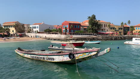 Fishing-boats-in-the-small-harbour-of-Goreé-Island,-just-off-the-coast-of-Dakar-in-Senegal