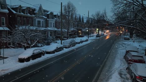 American-city-street-during-snow-flurries-at-dusk