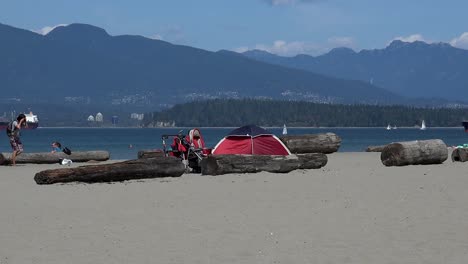 A-tent-blowing-in-the-wind-with-kids-on-a-beach