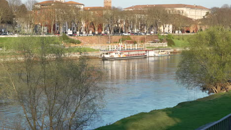 wonderful-view-of-Ticino-river-near-Pavia-and-moored-boat-at-sunny-day,-Lombardy,-italy