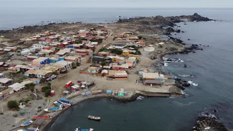 Colourful-buildings-of-small-fishing-town-in-Chile,-Caleta-Chanaral