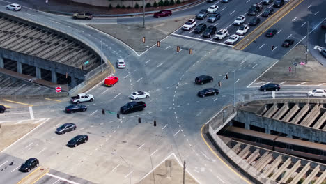 Train-Passing-Under-The-Cars-Driving-On-Cross-Intersection-In-Atlanta,-Georgia