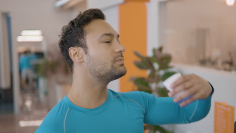 Fit-Fitness-Man-Drinks-Water-From-Paper-Cup-at-Gym-in-slow-motion