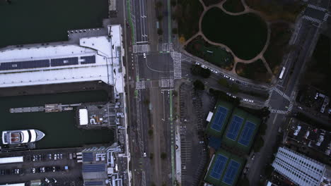 Birds-Eye-Aerial-View-of-Traffic-by-Piers-in-San-Francisco-USA,-The-Embarcadero-in-Twilight