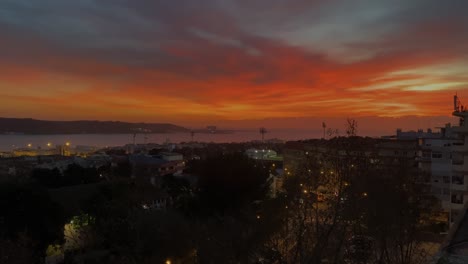 Dramatic-Sunset-Skies-over-Lisbon-Town-Skyline,-Portugal