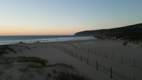 Aerial-view-under-the-dunes-of-Guincho-beach-in-Cascais