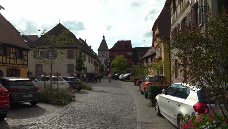 Tourists-Walk-on-the-Cobble-Stone-Streets-in-Bergheim-Village