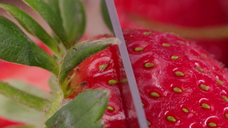 Macro-shot-of-Strawberry-being-cut-into