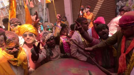 pov-shot-People-are-being-attracted-and-entertained-in-a-different-way-by-the-temple-staff-playing-music-from-a-very-large-drum