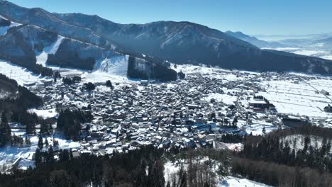 Aerial-drone-shot-of-Japans-Nozawaonsen-Mountain-Ski-Resort-Village