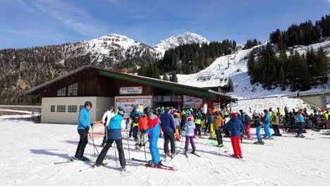 People-are-queuing-in-front-of-the-ski-pass-gates-to-access-the-chairlifts-in-Nassfeld,-Austria