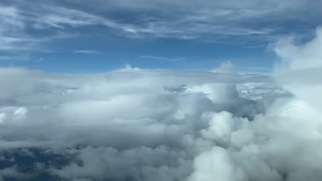 Pilot-POV-flying-across-a-turbulent-sky-plenty-of-storm-clouds-ahead