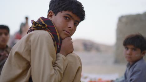 Closeup-shot-of-Pakistani-boy-staring-at-camera-in-Khuzdar,-Pakistan