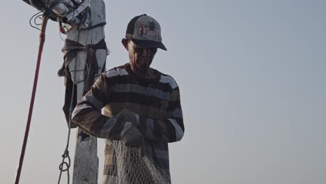 A-traditional-fishermen-carefully-pull-and-sort-their-nets-to-reveal-their-catch-from-the-sea