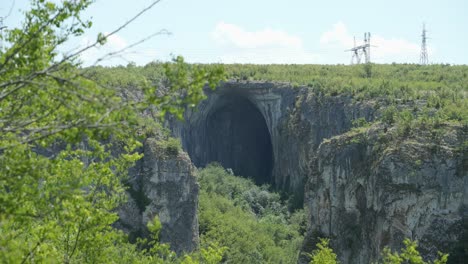 Hole-To-The-Prohodna-Karst-Cave,-God's-Eyes-Near-Karlukovo-In-Lukovit,-Bulgaria