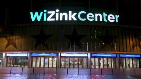 The-WiZink-Center-Madrid's-indoor-sports,-trade,-and-music-event-arena,-and-main-entrance-seen-at-nighttime