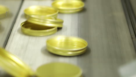 Cap-Lining-Machine-During-Production-Process,-Closeup-Shot