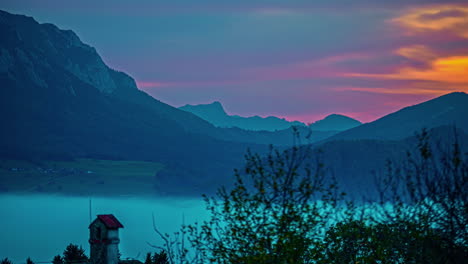 Central-Alps,-Austria,-Europe---A-Sight-of-Fog-in-the-Mountains-at-Sunset---Timelapse
