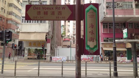 Shot-of-a-board-showing-Des-Voeux-Rd-in-Kennedy-town-of-Hong-Kong