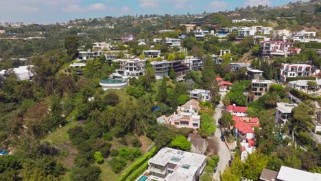 Aerial-Shot-Flying-Over-Luxurious-Celebrity-Neighborhood-of-Trousdale-Estates-in-West-Hollywood-Beverly-Hills,-Large-Manor-with-Infinity-Pools-Below