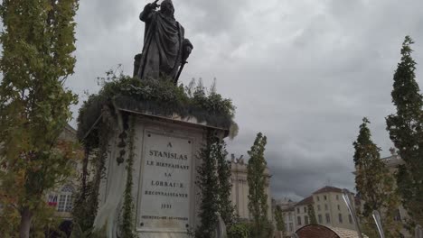 Bronze-statue-of-Stanislas-in-Lorraine-under-a-cloudy-sky-at-dusk-during-the-2019-ephemeral-garden