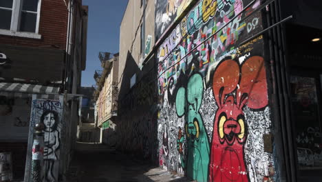 Wide-establishing-shot-of-graffiti-alleyway-in-Toronto's-Kensington-Market