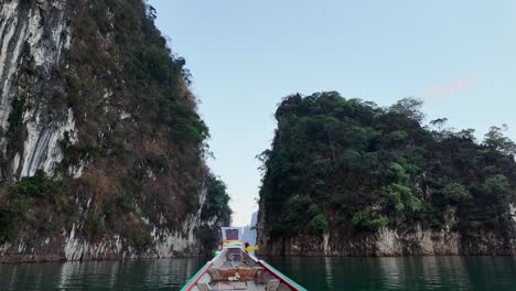 Natural-attractions-from-a-long-tailed-boat-in-Ratchaprapha-Dam-at-Khao-Sok-National-Park,-Suratthani,-Thailand