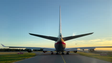 Pilot's-POV-Behind-a-B747-on-the-Taxiway,-Turboprop-Airplane-Landing