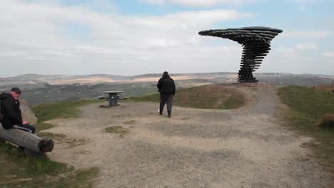 Drone-follows-visitors-to-Singing-Ringing-Tree-on-scenic-path