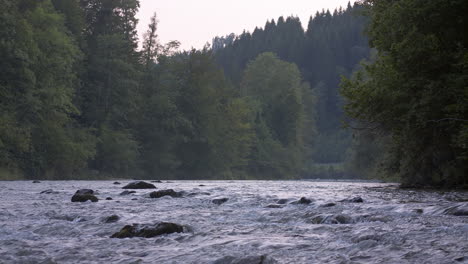 Water-flows-down-the-river-at-dawn-in-the-mountain-landscape-between-stones